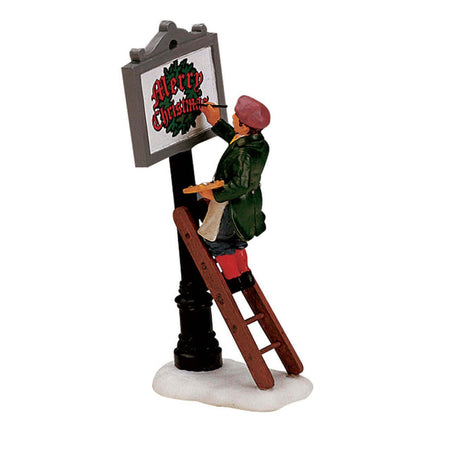 Statuetta natalizia Artista sul cartello decorazione per presepe villaggio di Natale in poliresina