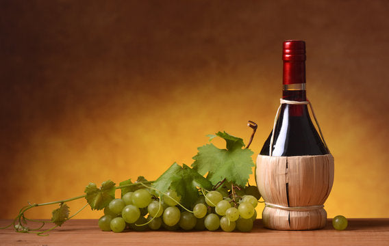 Fiasco in vetro rivestito in paglia per conservazione vino alcolici e distillati