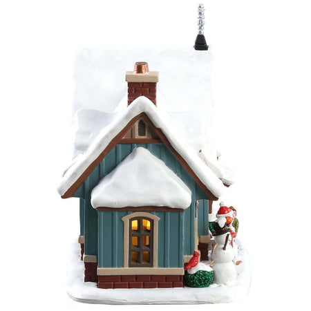 Giornata della neve, edificio luminoso per villaggio di Natale in Porcellana