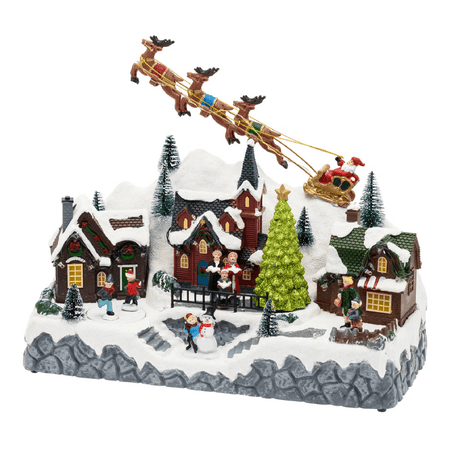 Paesaggio natalizio con Babbo Natale su slitta volante e pattinatori in movimento, led multicolor