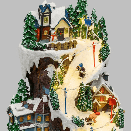 Villaggio Innevato con Sciatori, Trenino in Galleria in movimento in Polyresina, h 38 cm