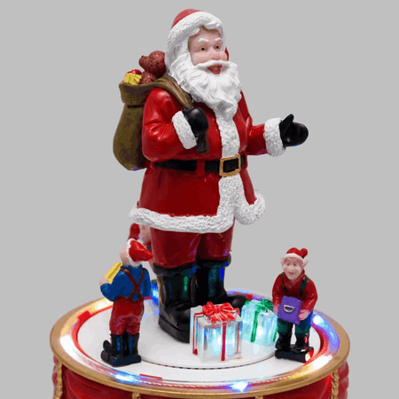Babbo Natale con Elfi in movimento rotatorio, h 19 cm, musiche natalizie