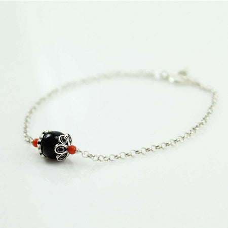Bracciale in argento Su Coccu con onice e coralli portafortuna Sardegna