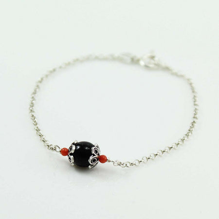 Bracciale in argento Su Coccu con onice e coralli portafortuna Sardegna