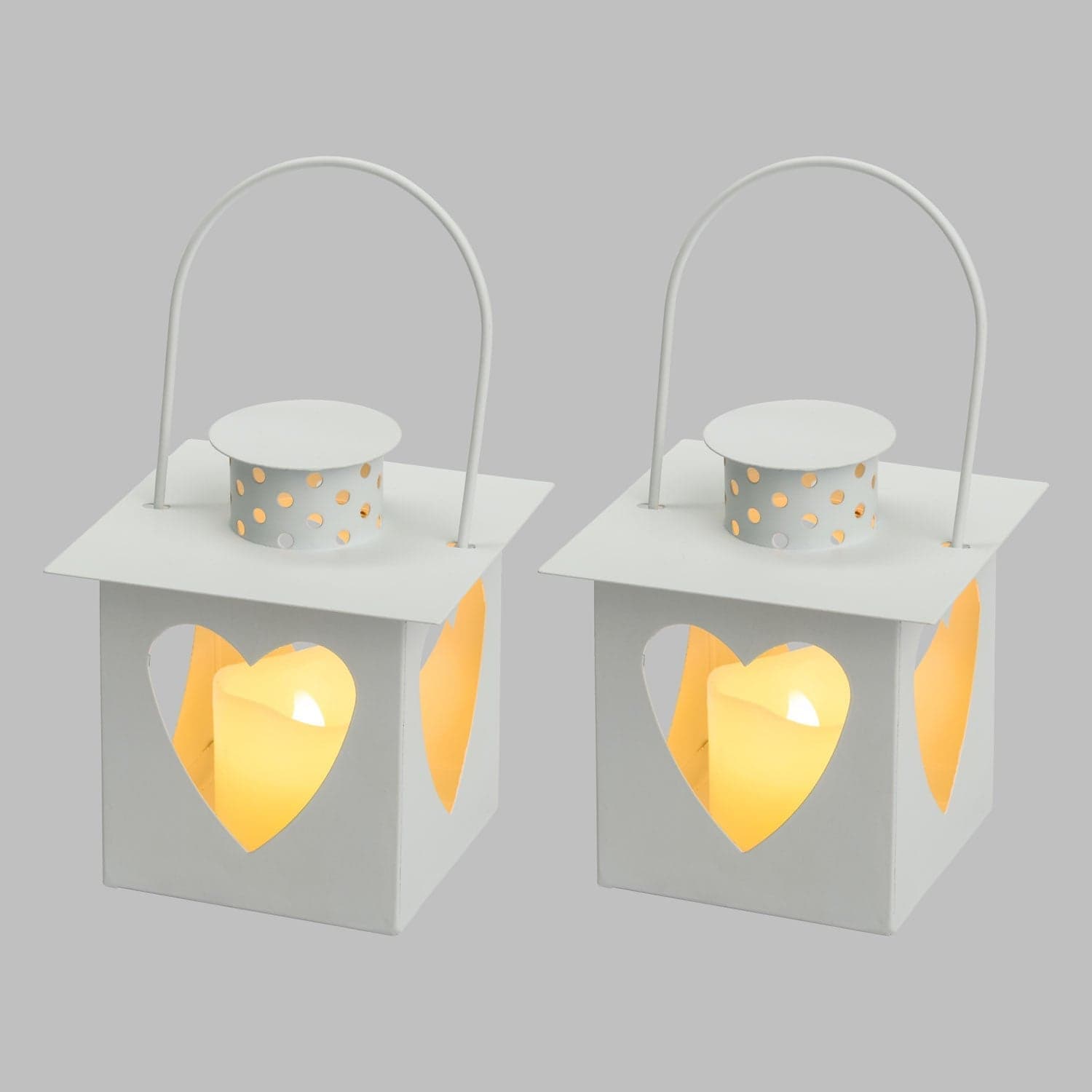 Set 2 lanterne e 2 candele a led con cuori traforati per decorazioni da interno. in Lanterne Decor Space - Altamura, commercioVirtuoso.it