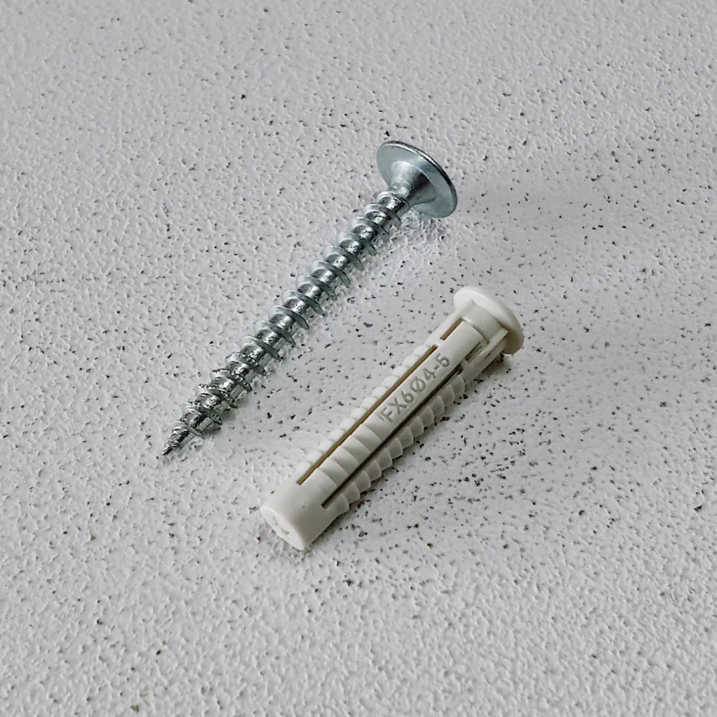 Unifix 6x30mm - 50pz tassello nylon FX con bordino e vite testa piana larga zincata - 2