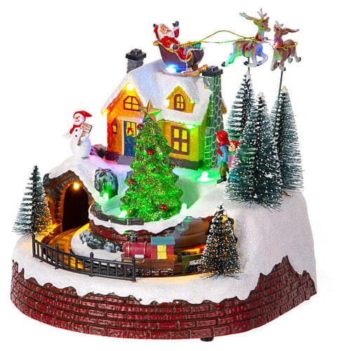Scena animata per villaggio di Natale con personaggi con luci e movimento h 21 cm - 8