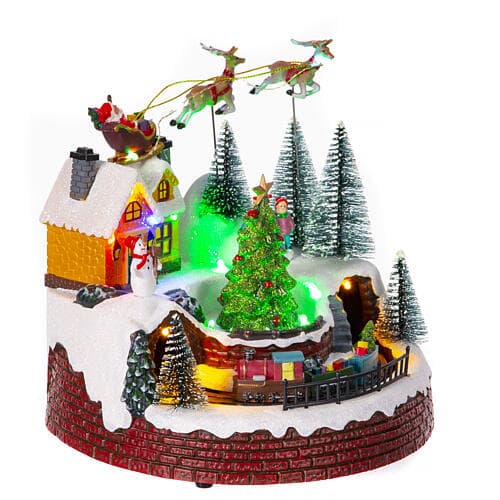 Scena animata per villaggio di Natale con personaggi con luci e movimento h 21 cm - 9