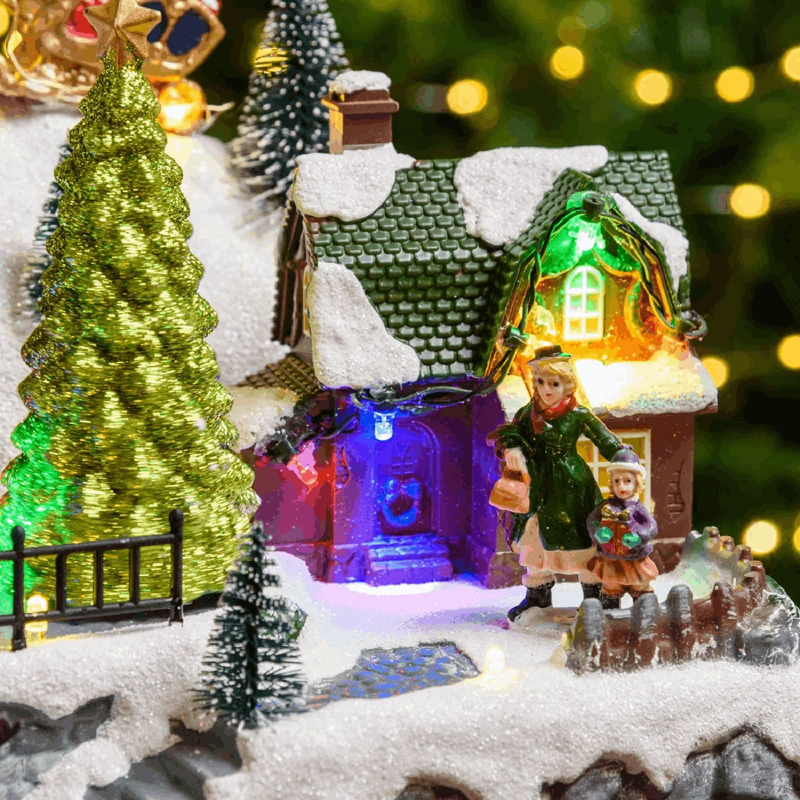 Paesaggio natalizio con Babbo Natale su slitta volante e pattinatori in movimento, led multicolor - 2