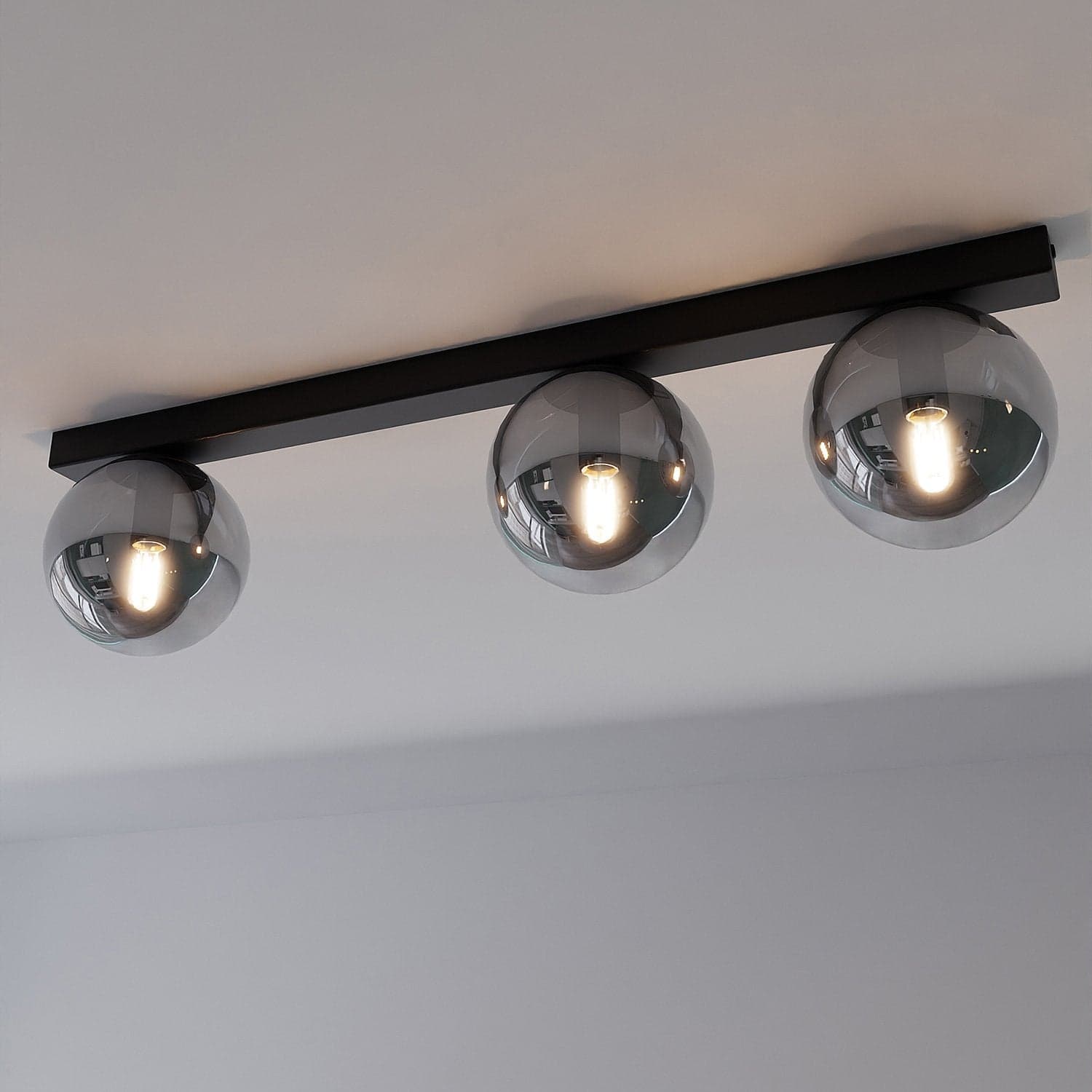 Plafoniera Moderna 3 Luci Fit Barra In Acciaio Nero E Sfere Di Vetro Fumè in Lampade a sospensione LuceArt - Montecorvino Pugliano, commercioVirtuoso.it