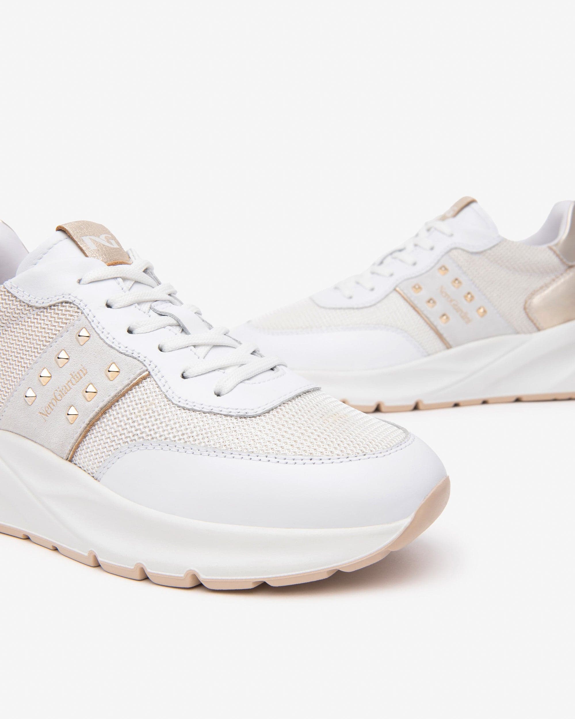 Nero Giardini sneakers donna bianco con borchie oro E512862D707 in Sneaker casual Teresi Calzature - Marsala, commercioVirtuoso.it