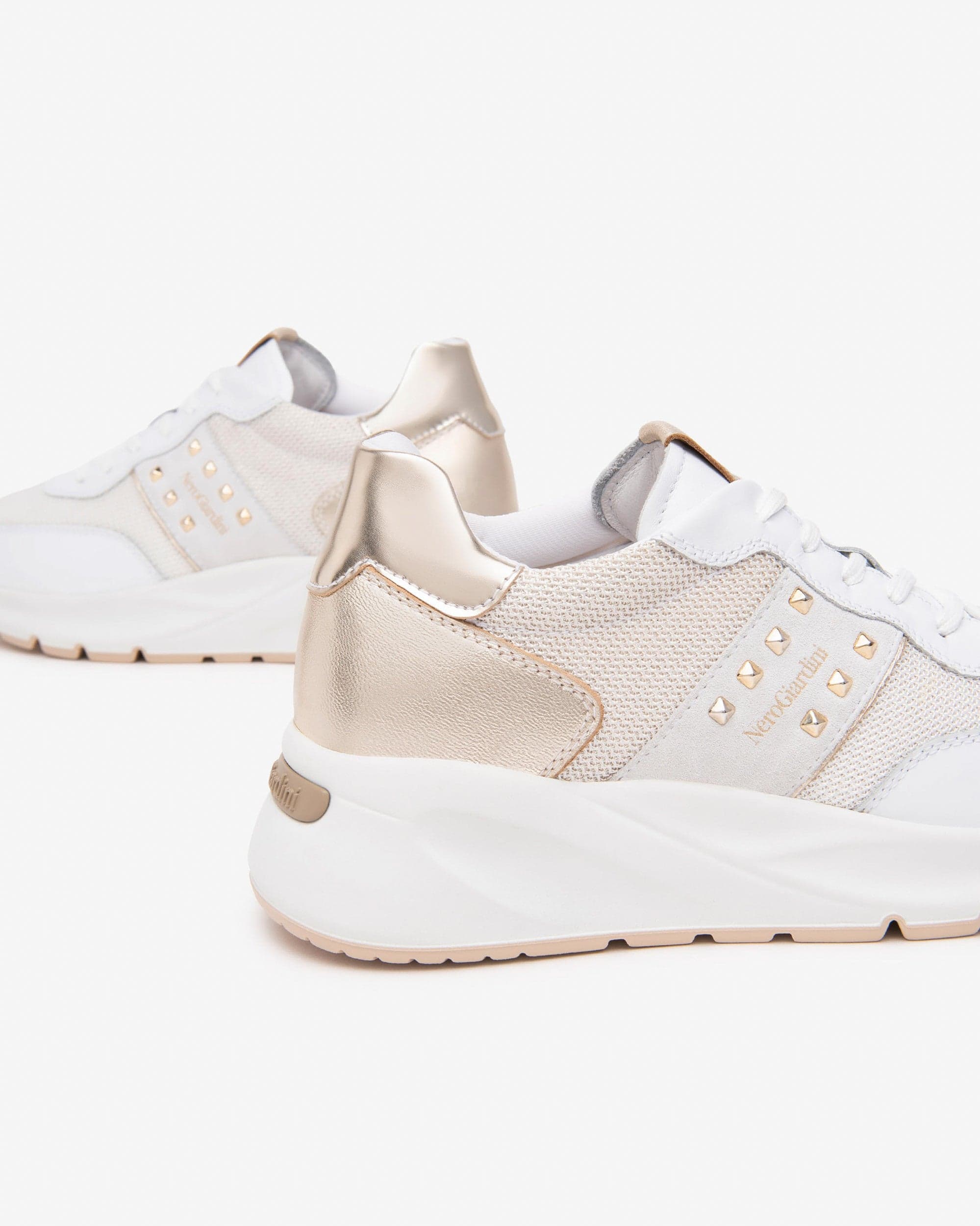 Nero Giardini sneakers donna bianco con borchie oro E512862D707 in Sneaker casual Teresi Calzature - Marsala, commercioVirtuoso.it