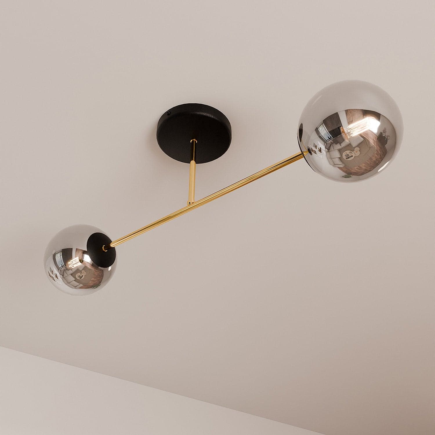Plafoniera Moderna Magnium 2 Luci In Acciao Oro E Sfere In Vetro Fumè in Lampadari LuceArt - Montecorvino Pugliano, commercioVirtuoso.it