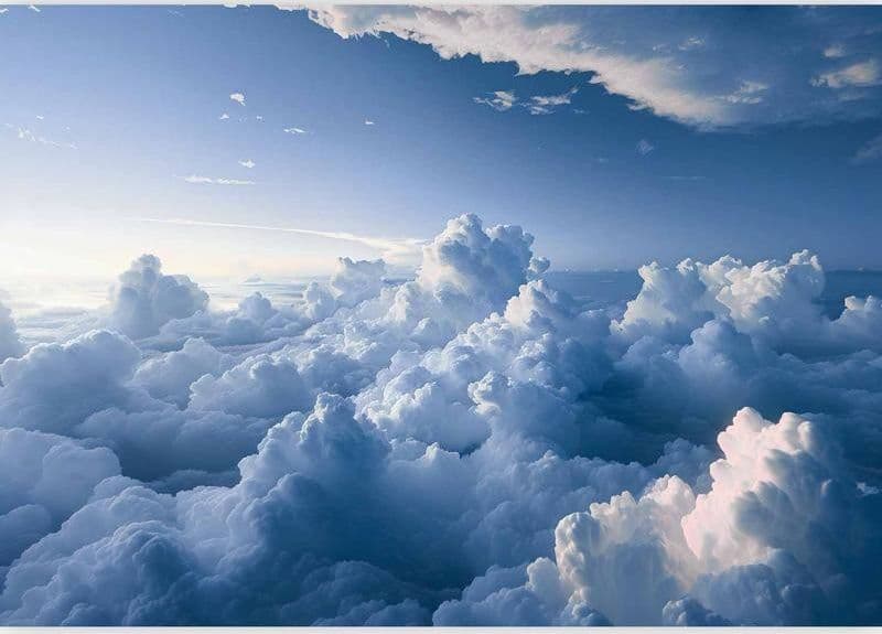 Carta da parati - Aerial Landscapes: Rays Lighting Up Fluffy Cloud Formations in Carta da parati Collezione Casa - Trebisacce, commercioVirtuoso.it