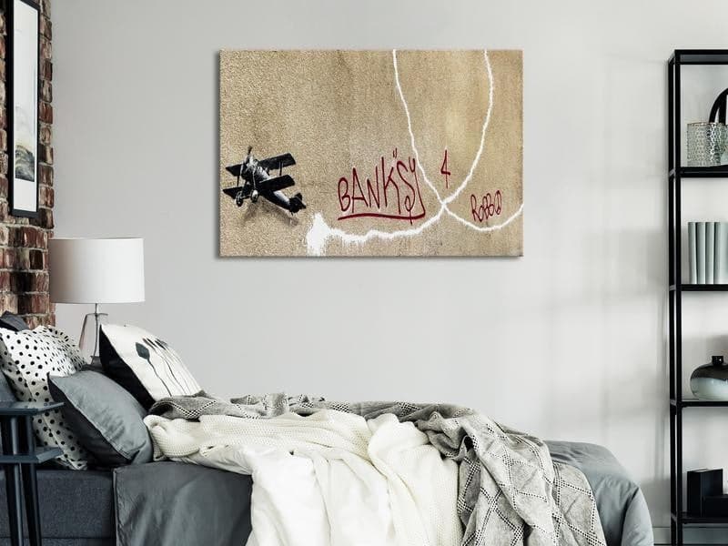 Quadro - Banksys Plane (1-part) - Red Graffiti Text on Mural Background in Poster e stampe Collezione Casa - Trebisacce, commercioVirtuoso.it