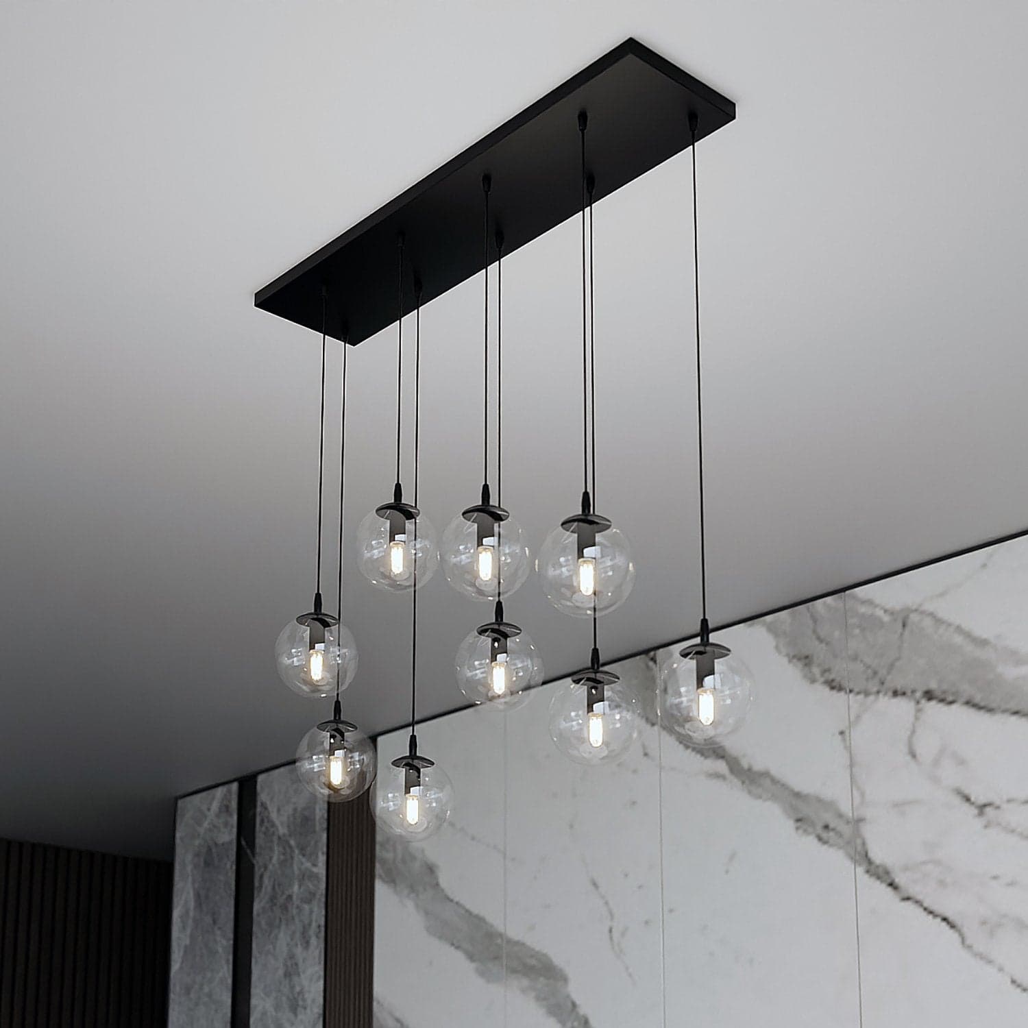 Sospensione Moderna 9 Luci Cosmo In Acciaio Nero E Sfere In Vetro Trasparente in Lampade a sospensione LuceArt - Montecorvino Pugliano, commercioVirtuoso.it