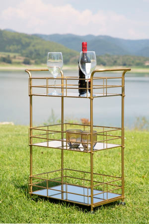 Carrello con ruote struttura in ferro color oro con 3 ripiani in specchio