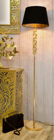 Lampada da terra struttura in metallo color oro e tessuto color nero per interni
