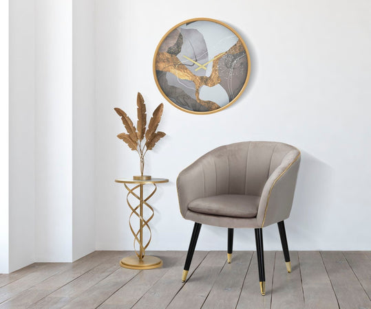 Tavolinetto tondo spiral in metallo color oro ripiano in vetro per interni