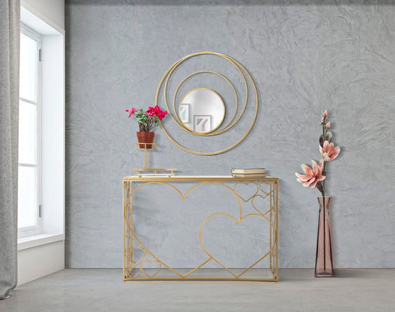 Console "Heart" struttura in metallo color oro ripiano in vetro per interni
