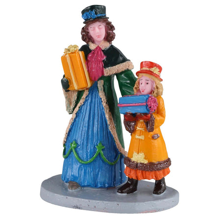 Shopping dei regali, personaggi per villaggio di Natale in poliresina