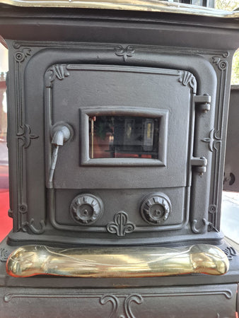 Stufa a legna "Parlor" 6 kW in ghisa con inserti ottone caminetto vintage