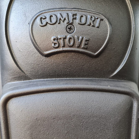 Stufa a legna "Comfort" 10 kW in ghisa con inserti ottone caminetto h 131 cm