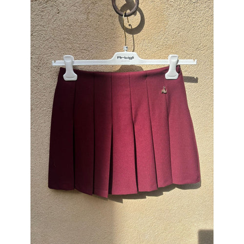 Gonna corta a pieghe