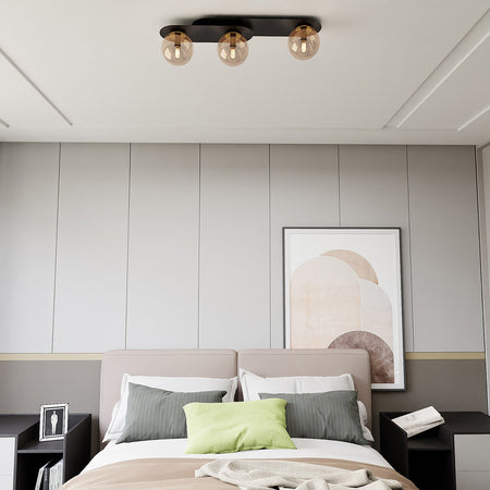 Plafoniera Minimal 3 Luci Plaza In Acciaio Nero E Sfere Vetro Ambra