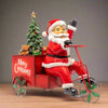 Statuetta natalizia decorativa Babbo Natale con triciclo con lei in resina da 53 cm