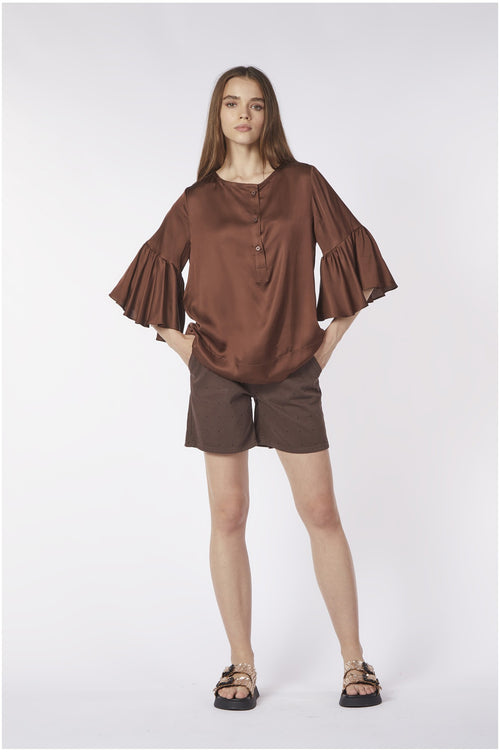 BLUSA CON BALZA ALLE MANICHE