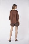 BLUSA CON BALZA ALLE MANICHE