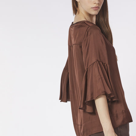 BLUSA CON BALZA ALLE MANICHE
