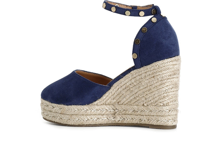 DÉCOLLETÉ IN TESSUTO CON BORCHIE SU ZEPPA CORDA