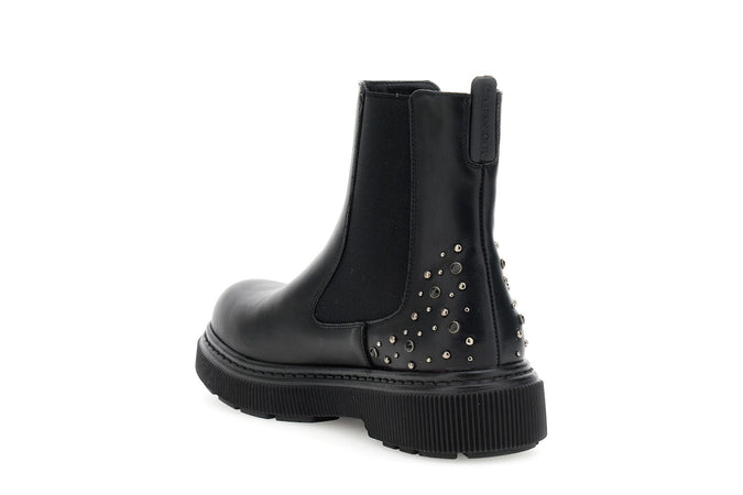 TRONCHETTO IN SINTETICO EFFETTO PELLE CON BORCHIE E ELASTICI