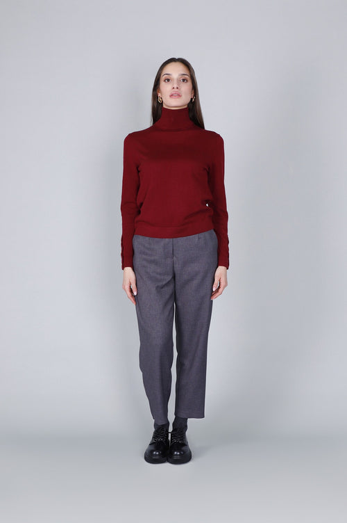 MAGLIA COLLO ALTO CON BOTTONI ALLE MANICHE