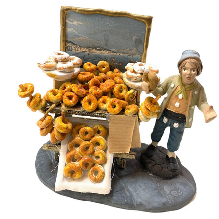 Pastore con ciambelle statuetta in terracotta artigianale per presepe napoletano