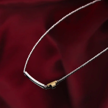 Collana TRUSSARDI donna T-Logo acciaio / oro / cristalli bianchi