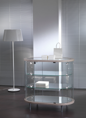 Vetrina a forma ovale per arredamento negozi con faretti su piedi fissi rialzati cm. 96x56x93h