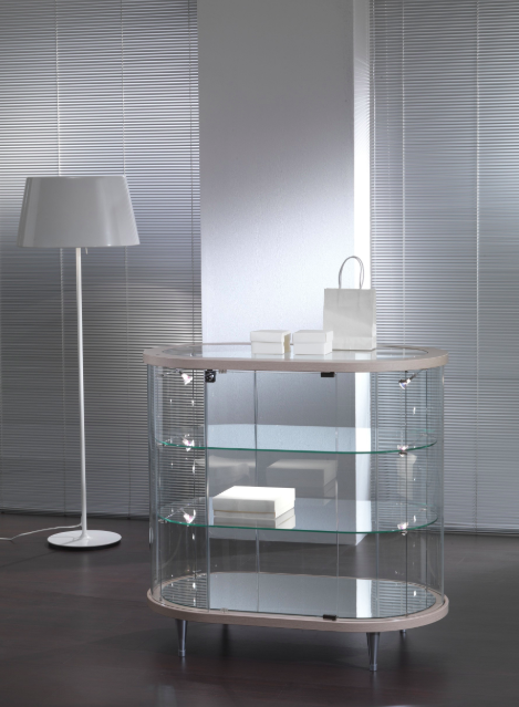 Vetrina a forma ovale per arredamento negozi con faretti su piedi fissi rialzati cm. 96x56x93h