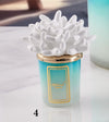 Candela piccola in ceramica bicolore Melaverde Linea Tropicana da 100gr, anemone bianco, fatta a mano e completa di scatola regalo elegante.