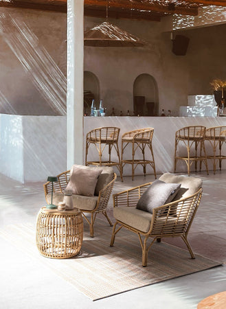 Poltrona "Mabel" con braccioli in alluminio effetto rattan da giardino