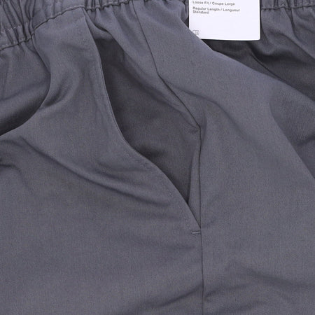 Nike Pantalone Lungo Uomo Sportswear Spu Woven Pant Iron Grey/safety Orange/black da uomo