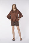 BLUSA CON BALZA ALLE MANICHE