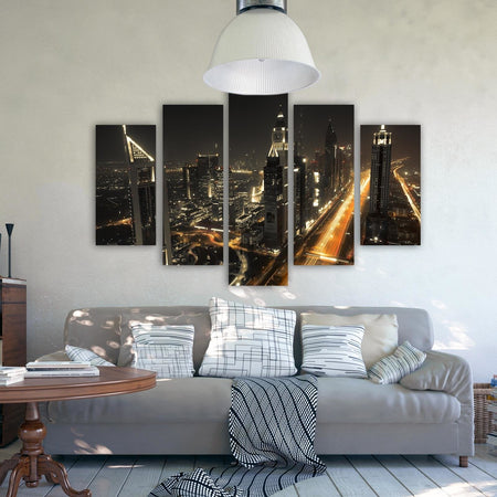 Quadro Multipannello Dubai di notte, panorama della città