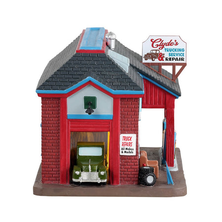 Decorazione "Clyde's Trucking Service & Repair" per Villaggio di Natale e presepe, in Porcellana da h 14,2 cm