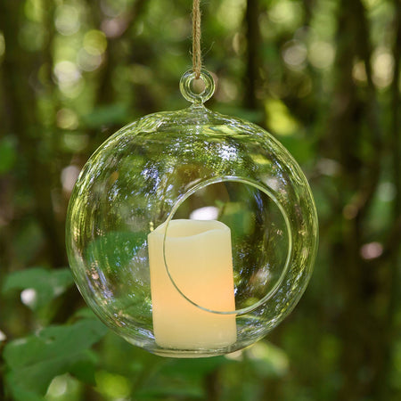 Sfera di vetro con candela a led effetto fiamma per giardino da interno ed esterno.