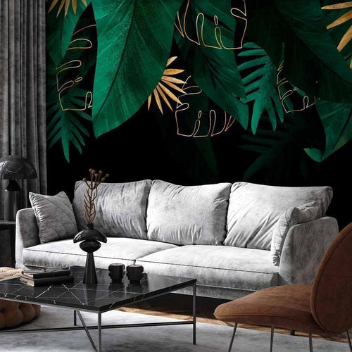 Carta da parati - Jungle and composition - motif of green and golden leaves on a black background