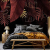 Carta da parati - Jungle and composition - red and gold leaf motif on black background