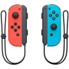 Console Nintendo Switch con una gioia rossa neon e un gioia blu neon